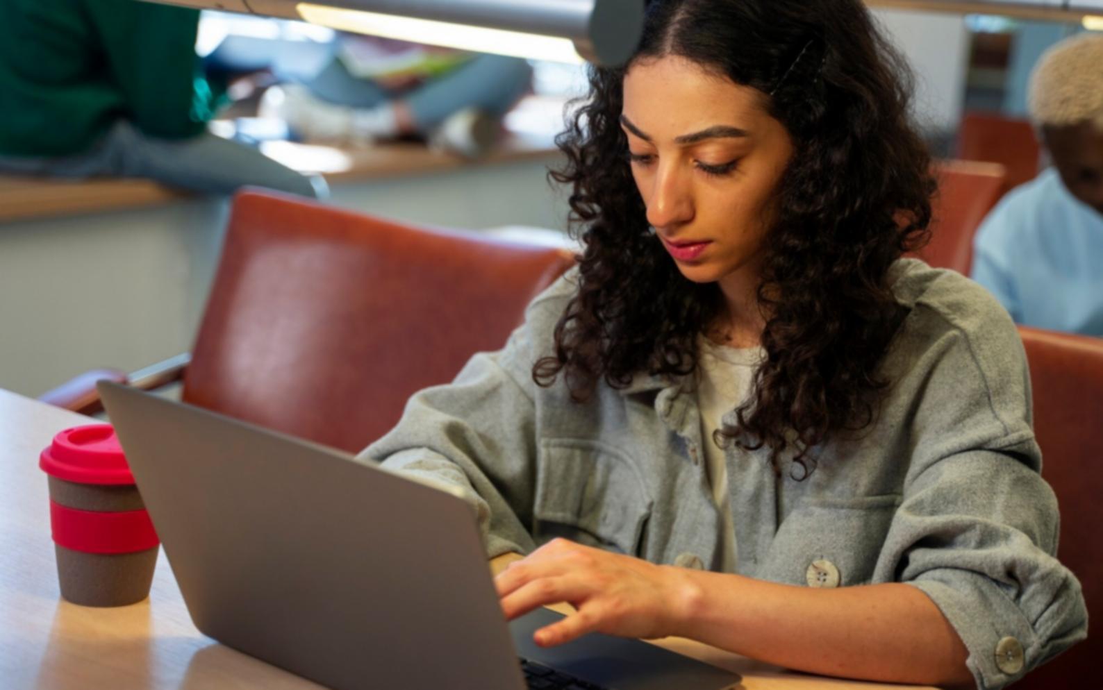 Workshop participant reviewing financial analysis materials during collaborative session